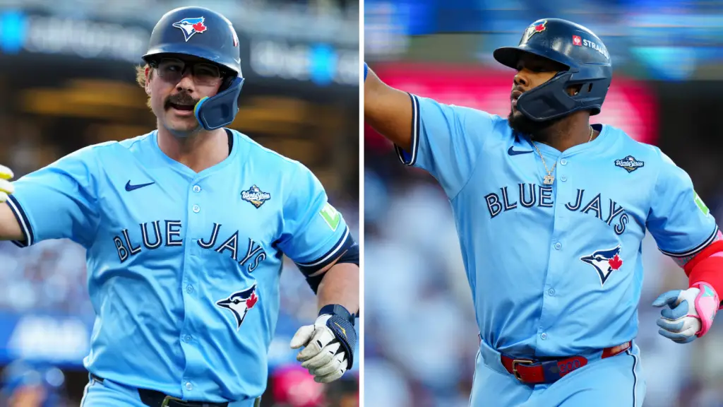 Toronto Blue Jays batters Davis Schneider and Vladimir Guerrero Jr celebrate hitting their first-inning home runs